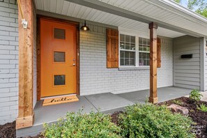 Exterior detail - the ORANGE DOOR just steps from art, trails & dining (Bentonville)