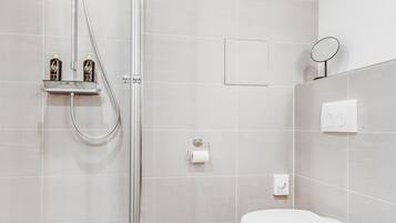 Suite M | Bathroom | Shower, hair dryer, towels, toilet paper