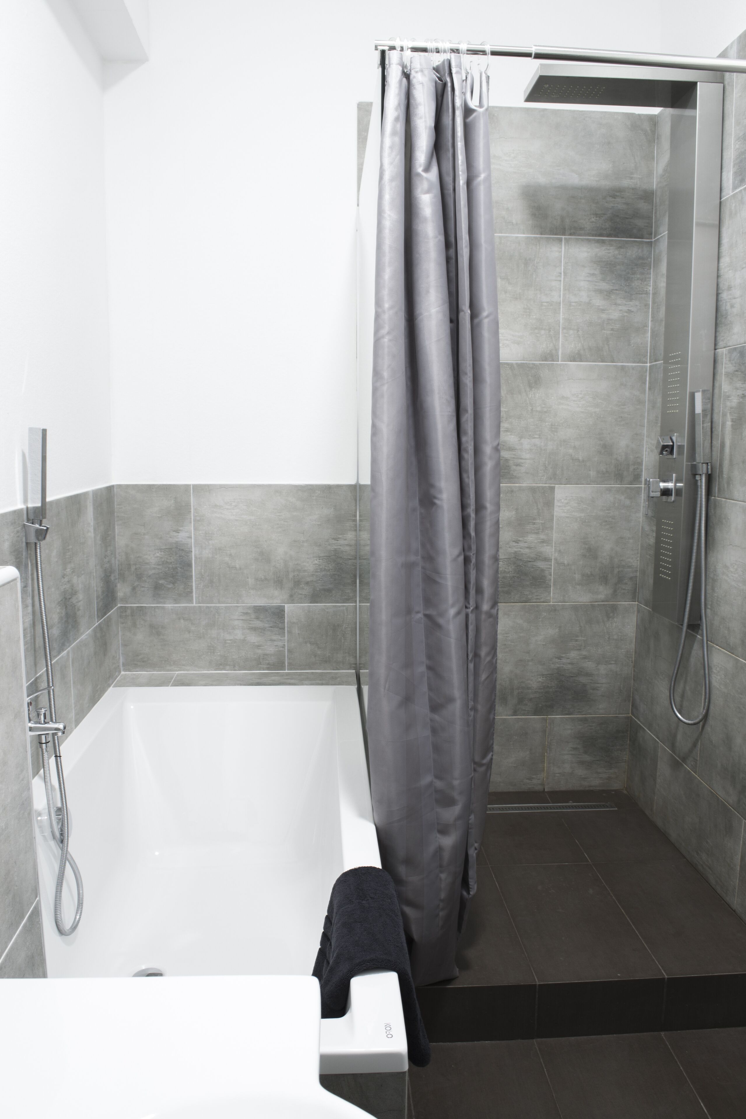 Bathtub, hair dryer, towels, soap