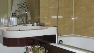 Combined shower/tub, hair dryer, towels, soap