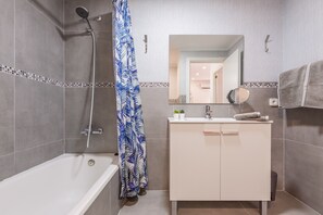 Bathtub, hair dryer, towels