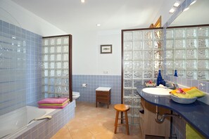 Bathtub, hair dryer, towels