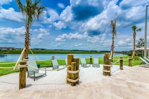 Relax in a serene outdoor space with lounge chairs and a clear view.