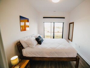 1 bedroom, desk, iron/ironing board, travel crib