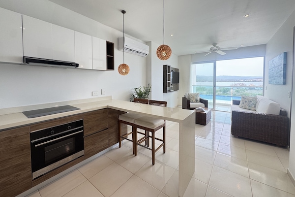 Apartamento, 1 quarto | Cozinha privada | Cooktop, talheres/pratos/utensílios de cozinha, freezer