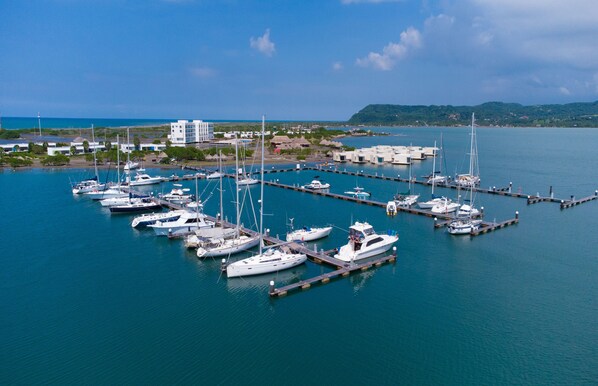 A marina with several boats docked at piers.