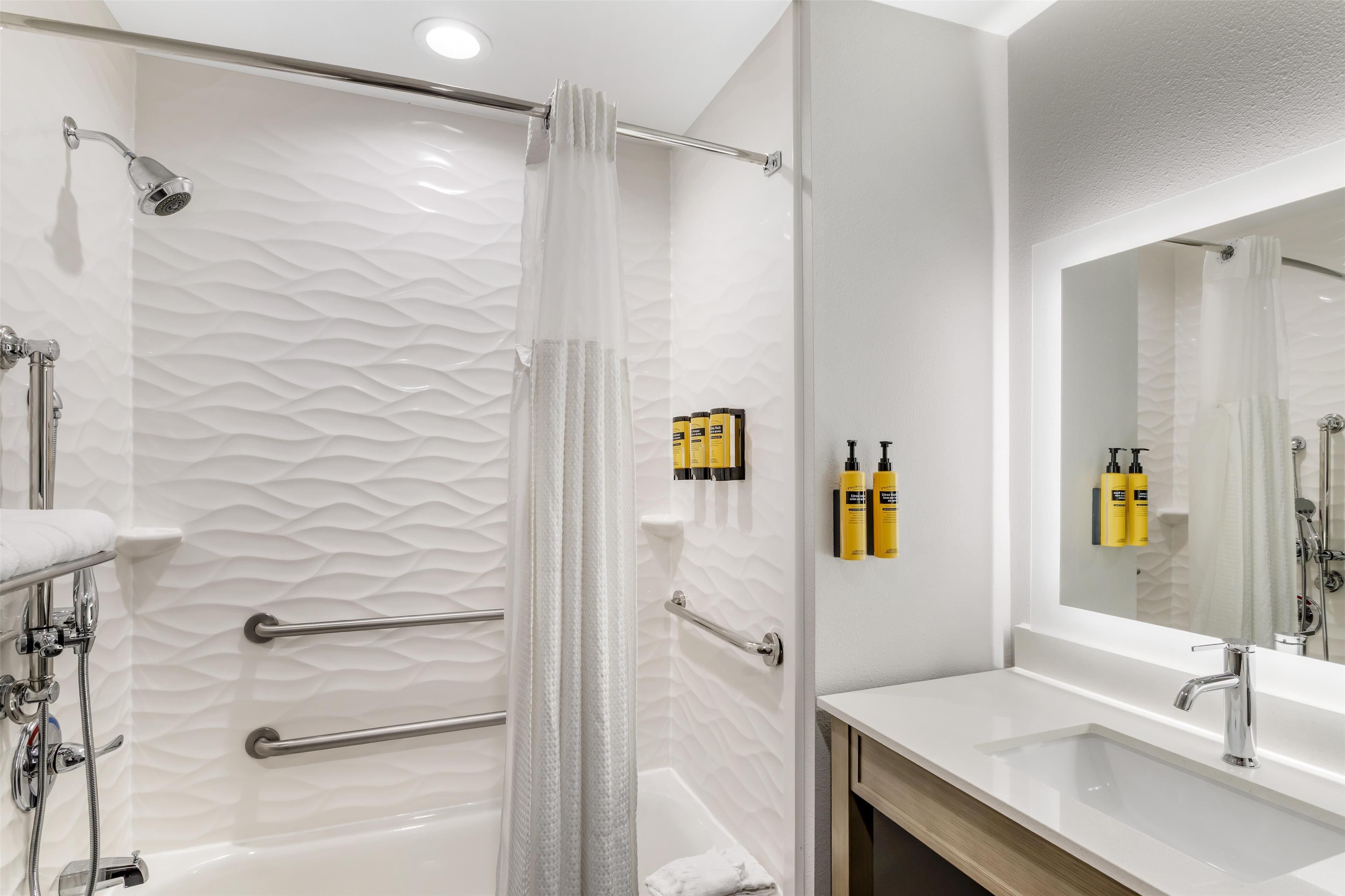 standard room, 1 king bed, accessible, refrigerator & microwave | bathroom | combined shower/bathtub, rainfall showerhead, free toiletries