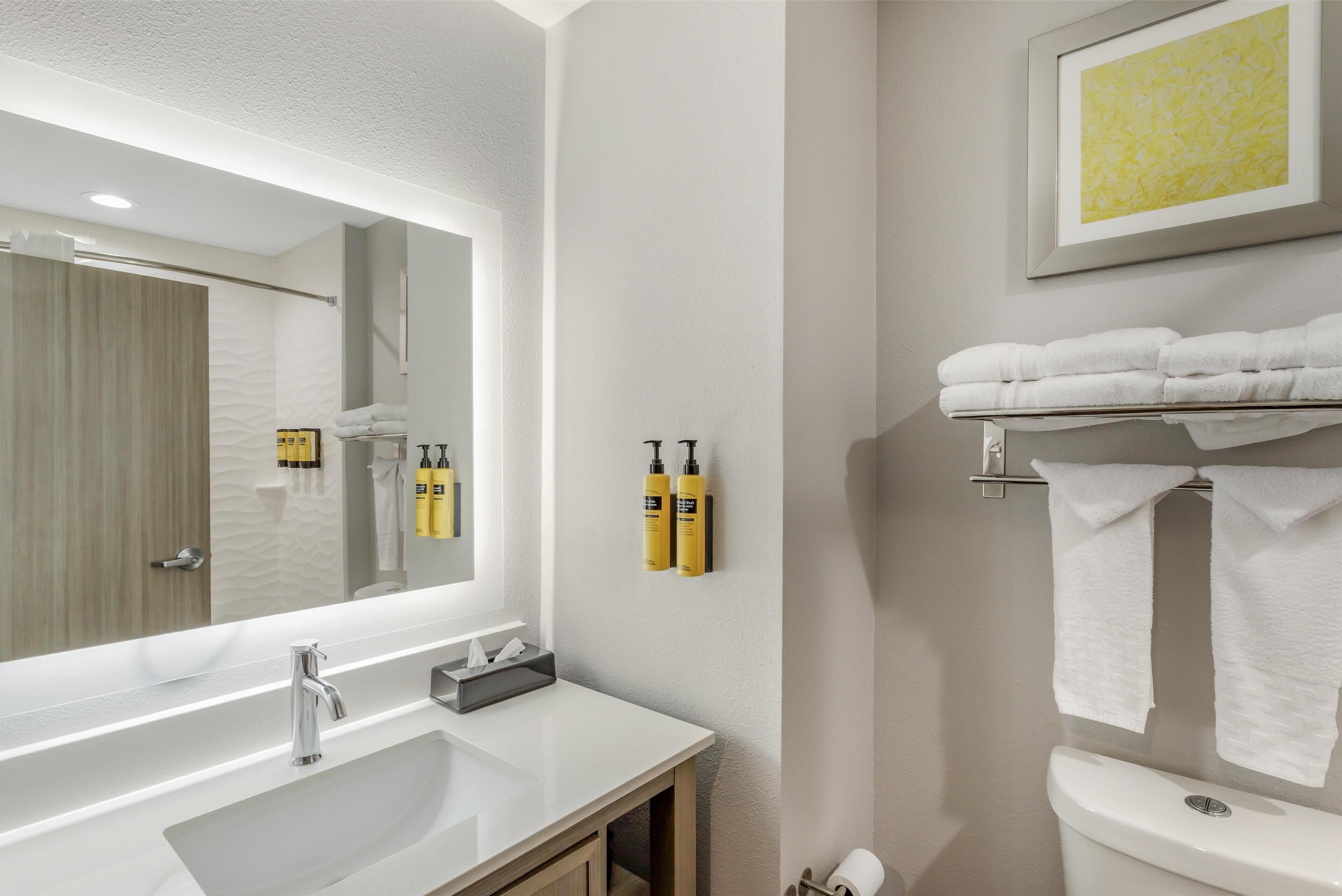 standard room, 2 queen beds, non smoking, refrigerator & microwave | bathroom | combined shower/bathtub, rainfall showerhead, free toiletries