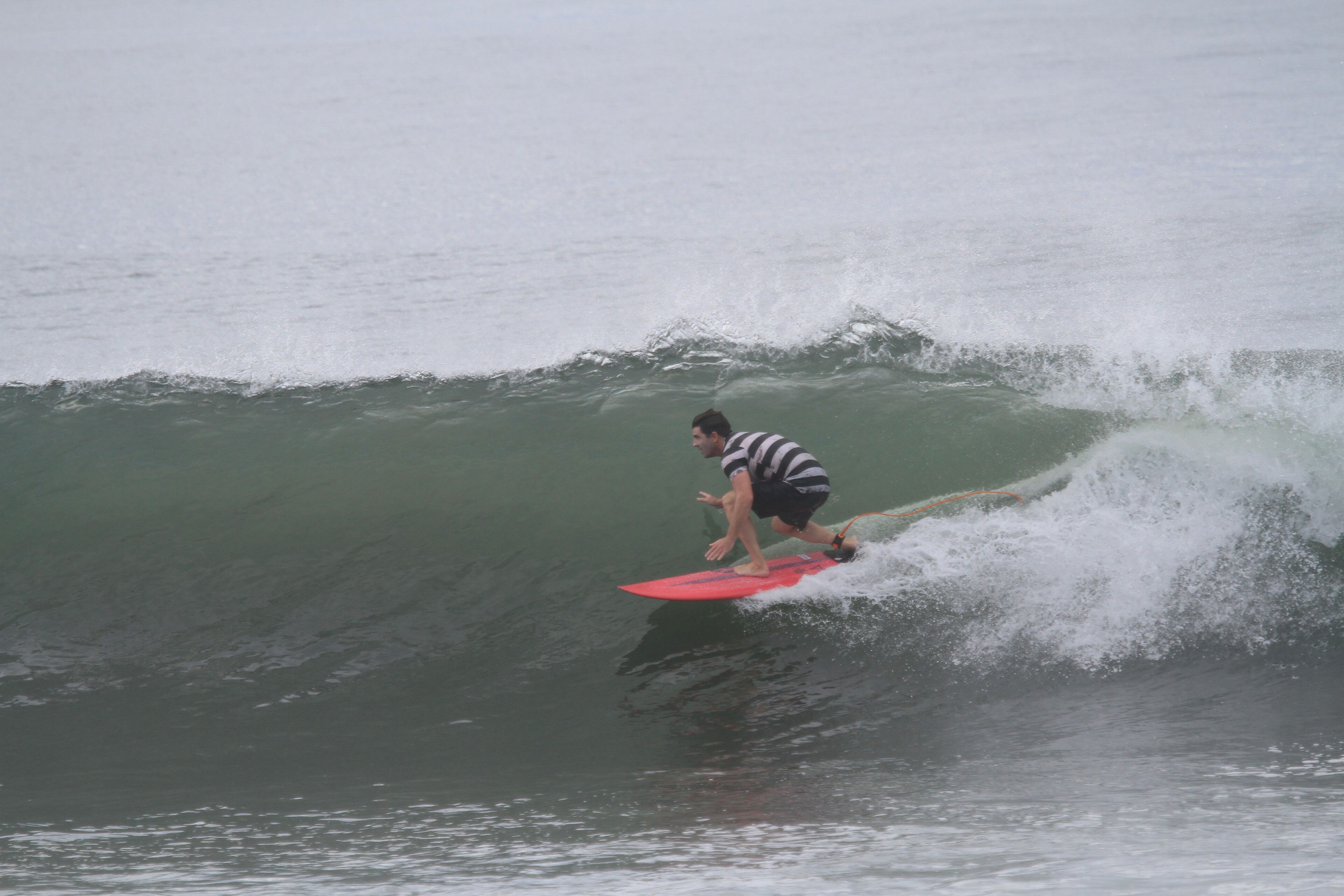 A person surfing on a wave.