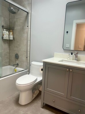 Shower, hair dryer, towels, soap