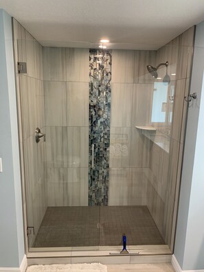 Shower, hair dryer, towels, toilet paper