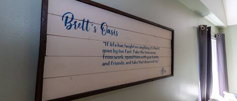 A framed quote on a wall.