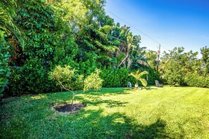 Escape to a serene outdoor oasis with lush greenery and a tranquil atmosphere.