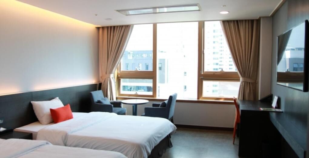 premium bedding, memory-foam beds, desk, laptop workspace