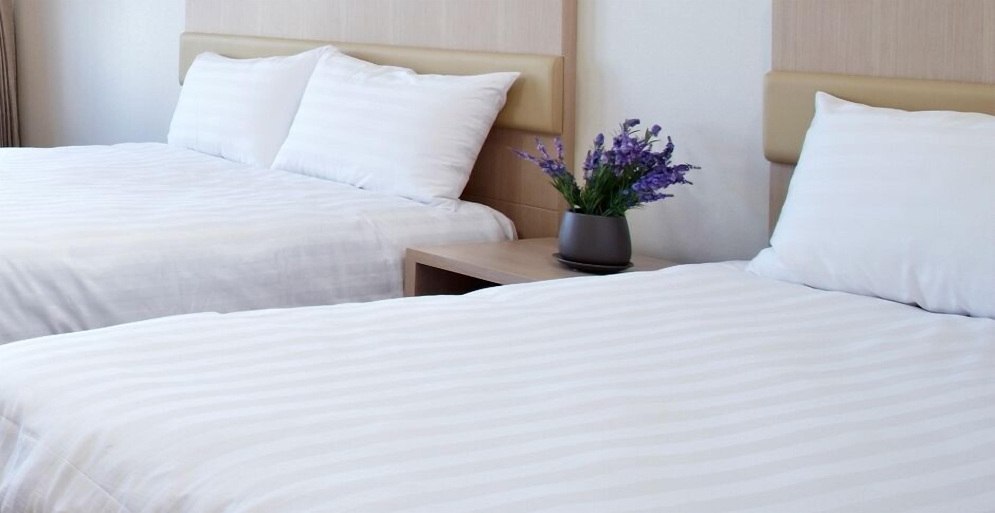 deluxe twin room | premium bedding, memory-foam beds, desk, laptop workspace