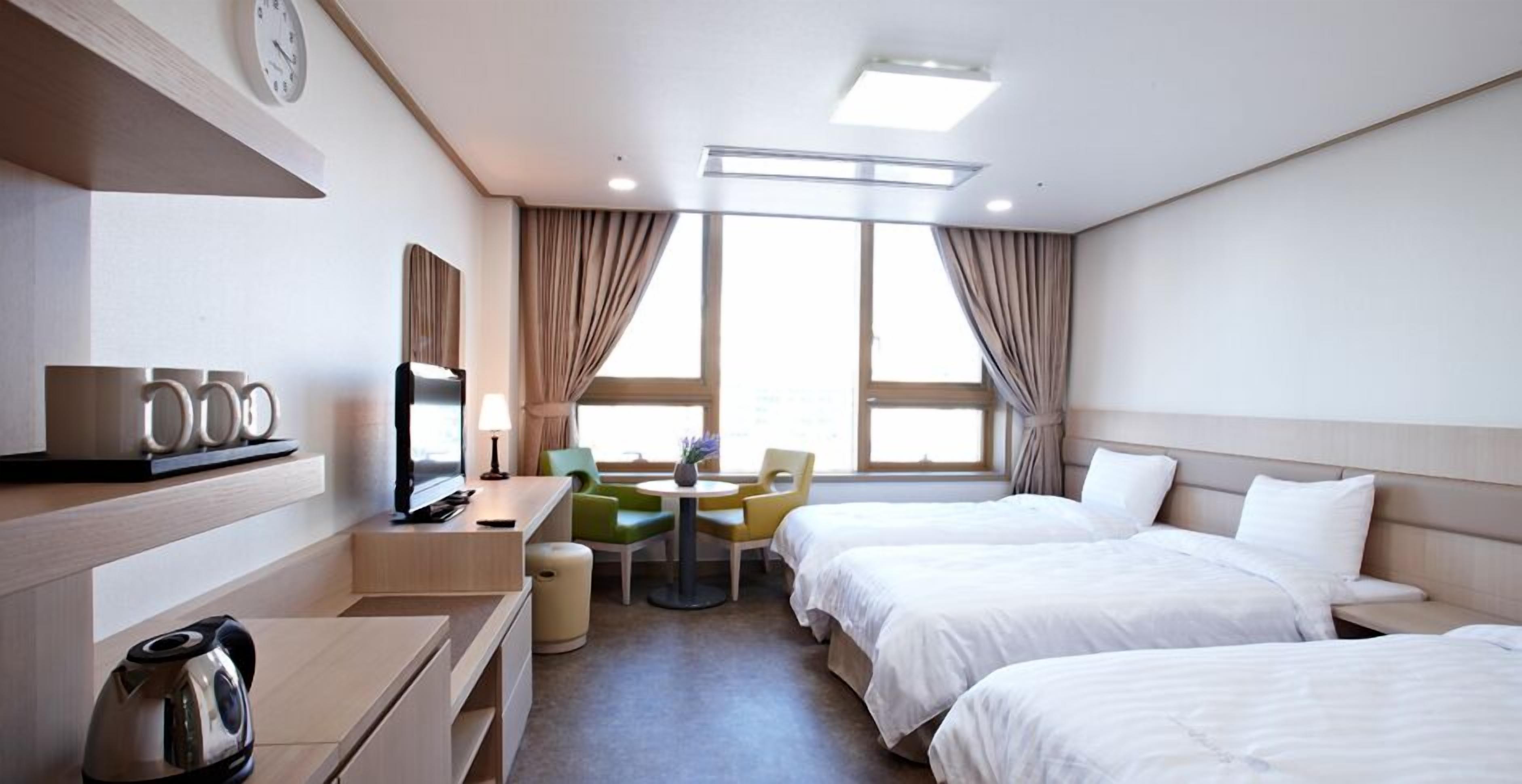 deluxe triple room | premium bedding, memory-foam beds, desk, laptop workspace