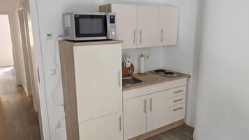 Fridge, microwave, stovetop, coffee/tea maker