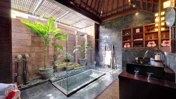 Separate tub and shower, rainfall showerhead, free toiletries