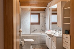 Bathtub, hair dryer, towels