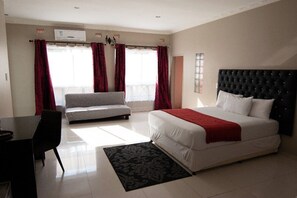 Habitación ejecutiva | Escritorio, espacio para trabajar con laptop y wifi gratis 