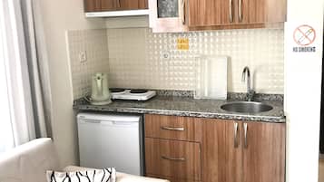 Mini-fridge, high chair, griddle, cookware/dishes/utensils