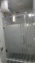 Rainfall showerhead, towels, soap, toilet paper