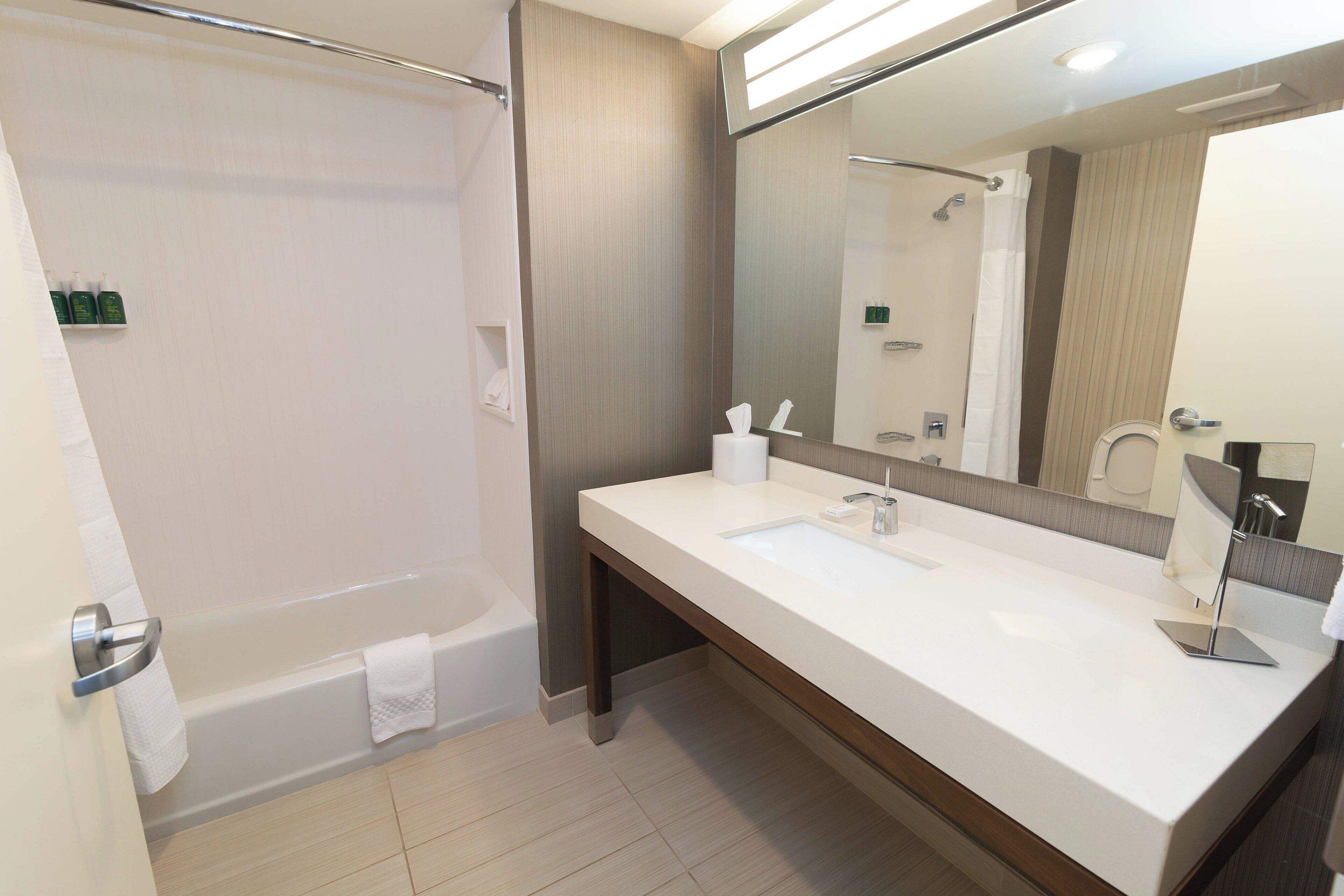 room, 2 queen beds | bathroom | free toiletries, hair dryer, towels, soap
