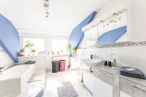 Bathtub, hair dryer, towels, soap