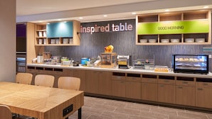 A breakfast bar with a sign reading "inspired table" and "GOOD MORNING". - Home2 Suites by Hilton Ft. Lauderdale Downtown, FL (Fort Lauderdale)