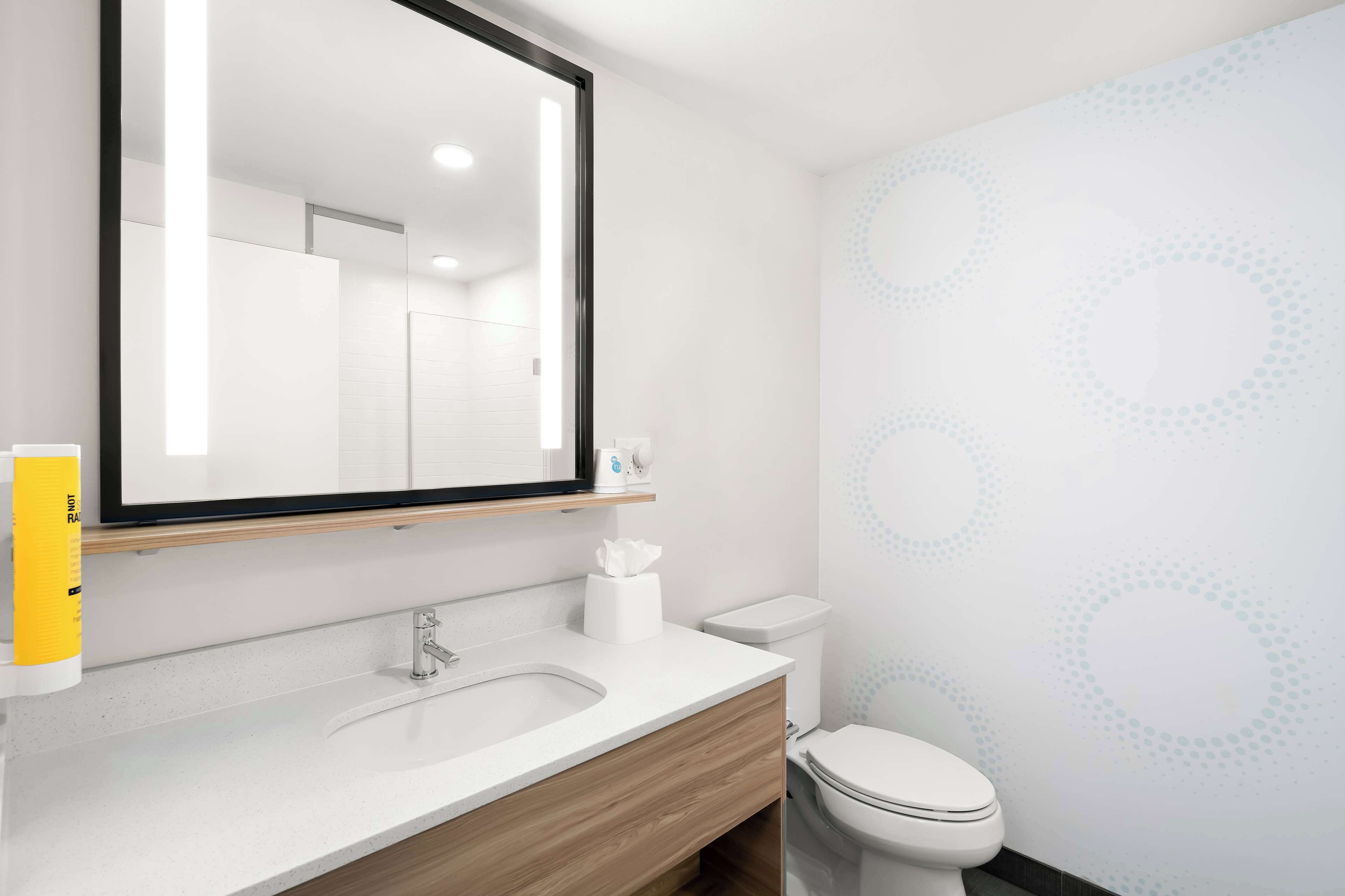 rainfall showerhead, hair dryer, towels, soap