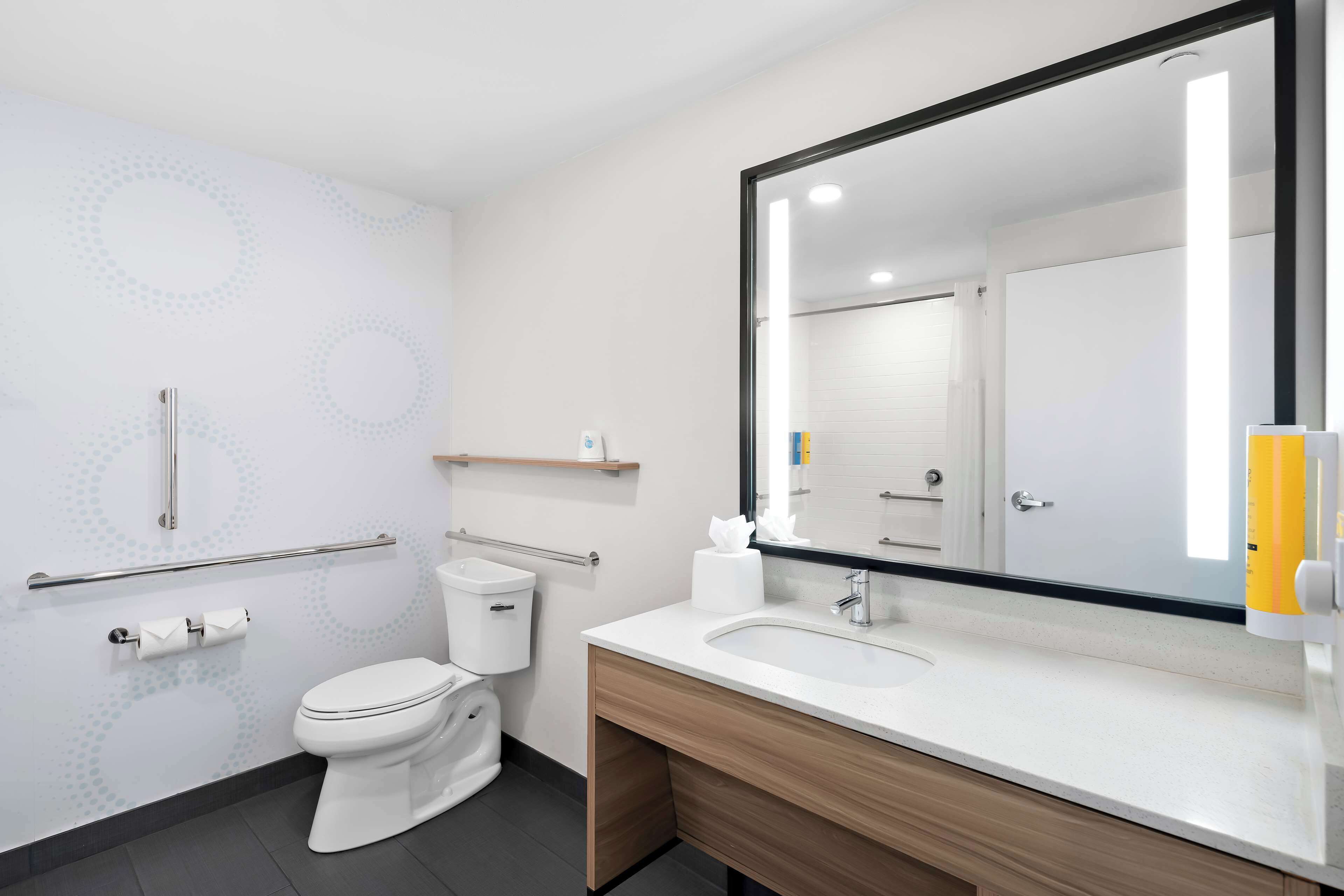 rainfall showerhead, hair dryer, towels, soap