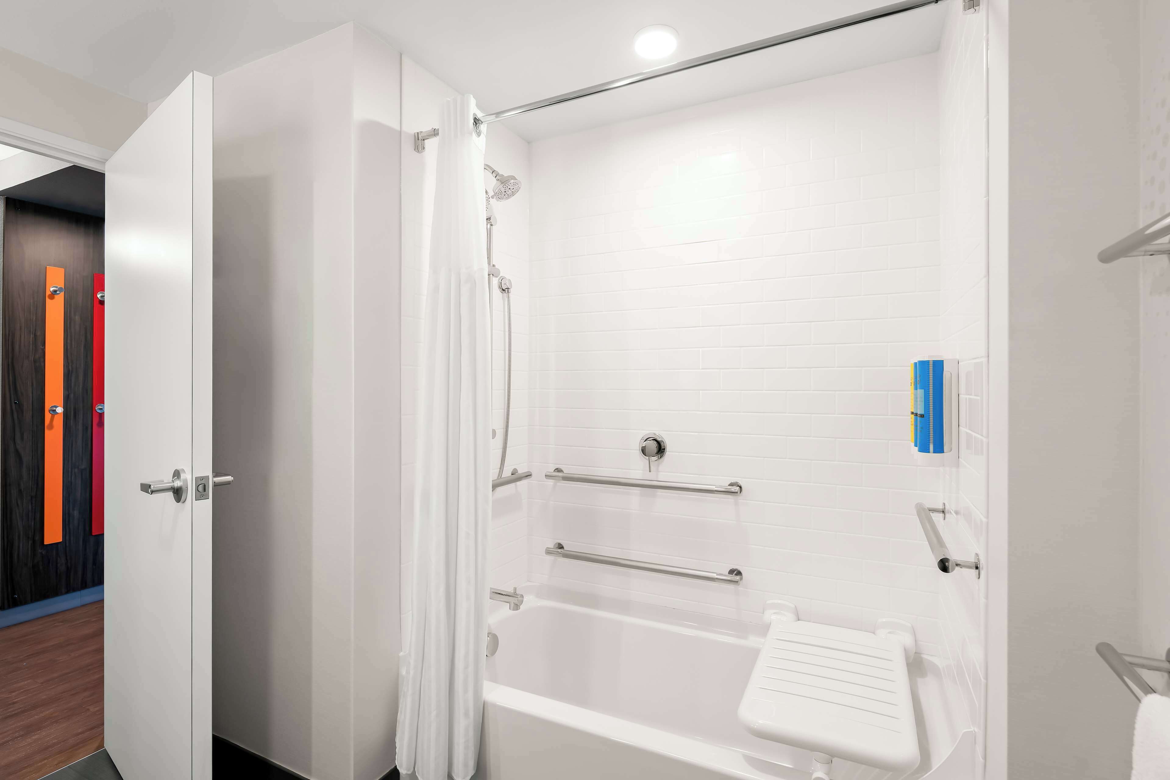 rainfall showerhead, hair dryer, towels, soap