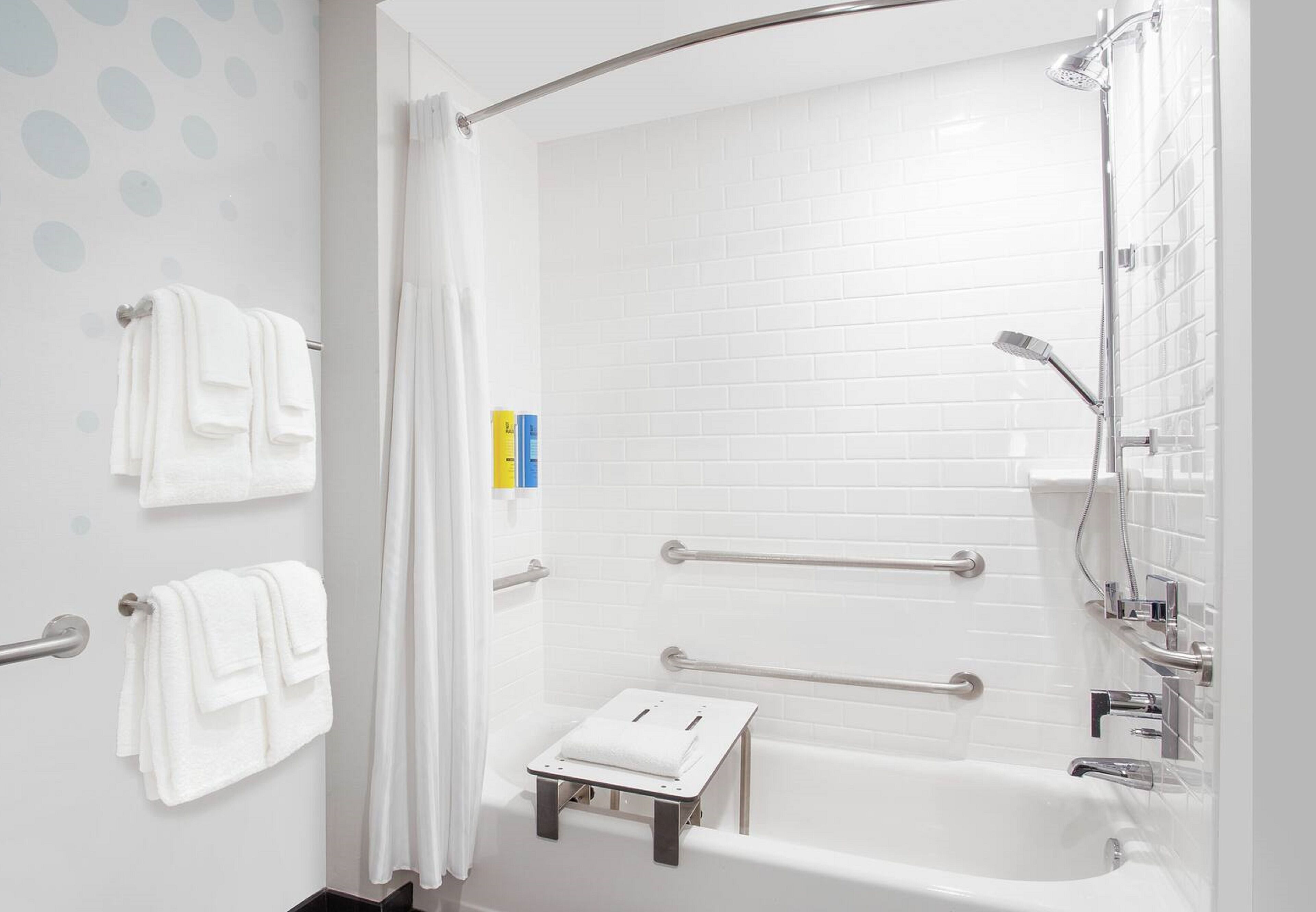 rainfall showerhead, hair dryer, towels, soap