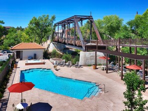 Outdoor pool, open 9:00 AM to 9:00 PM, pool loungers