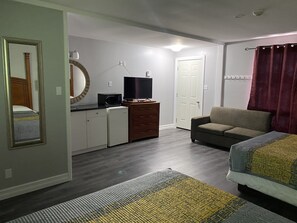 Standard Double Room | Living area | 42-inch LCD TV with cable channels, TV - Studio 1 Motel (Cobourg)