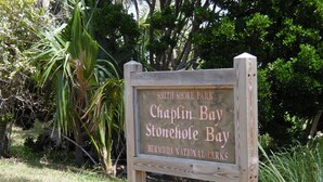 A wooden sign with the text 'South Shore Park Chaplin Bay Stonehole Bay, Bermuda National Parks'. - PalmSprings Accommodations - 2 Bedroom Apt., Near Horseshoe Bay (Southampton Parish)