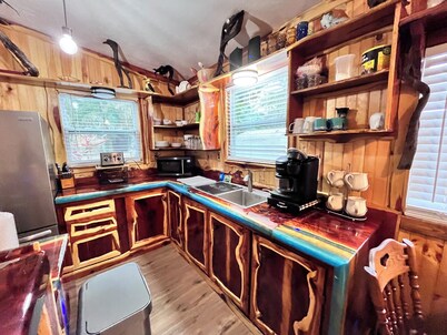 Waterfront Retreat with fenced yard, porch + bar, canal views, NEW DOCK