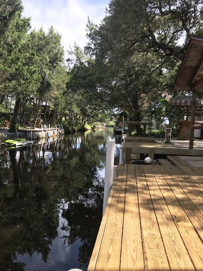 Waterfront Retreat with fenced yard, porch + bar, canal views, NEW DOCK