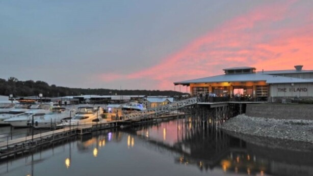 A waterfront property with a dock, boats, and a building labeled "The Island".