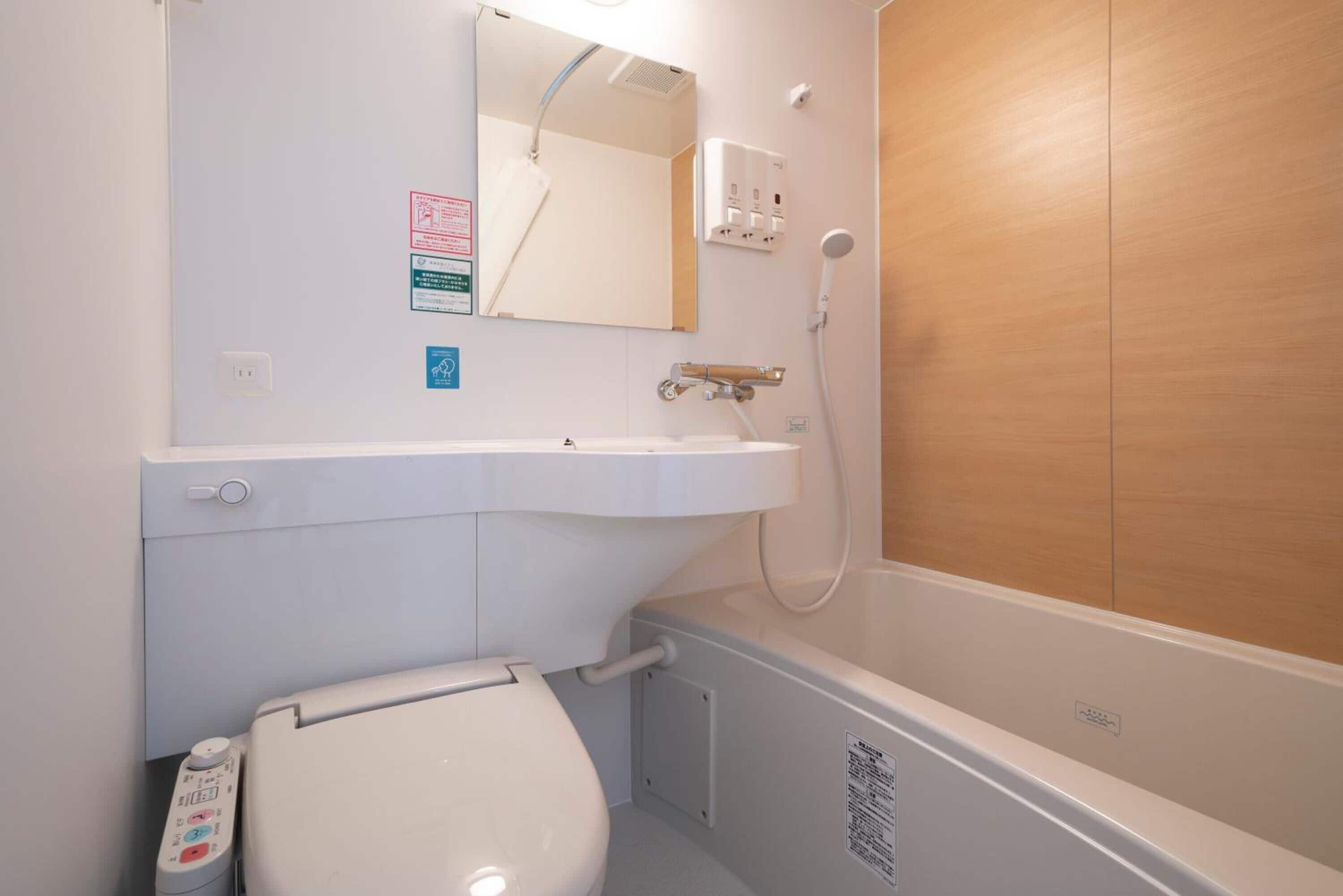 combined shower/bathtub, free toiletries, hair dryer, slippers