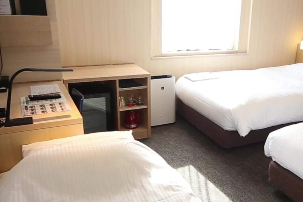 triple room | in-room safe, desk, laptop workspace, blackout curtains