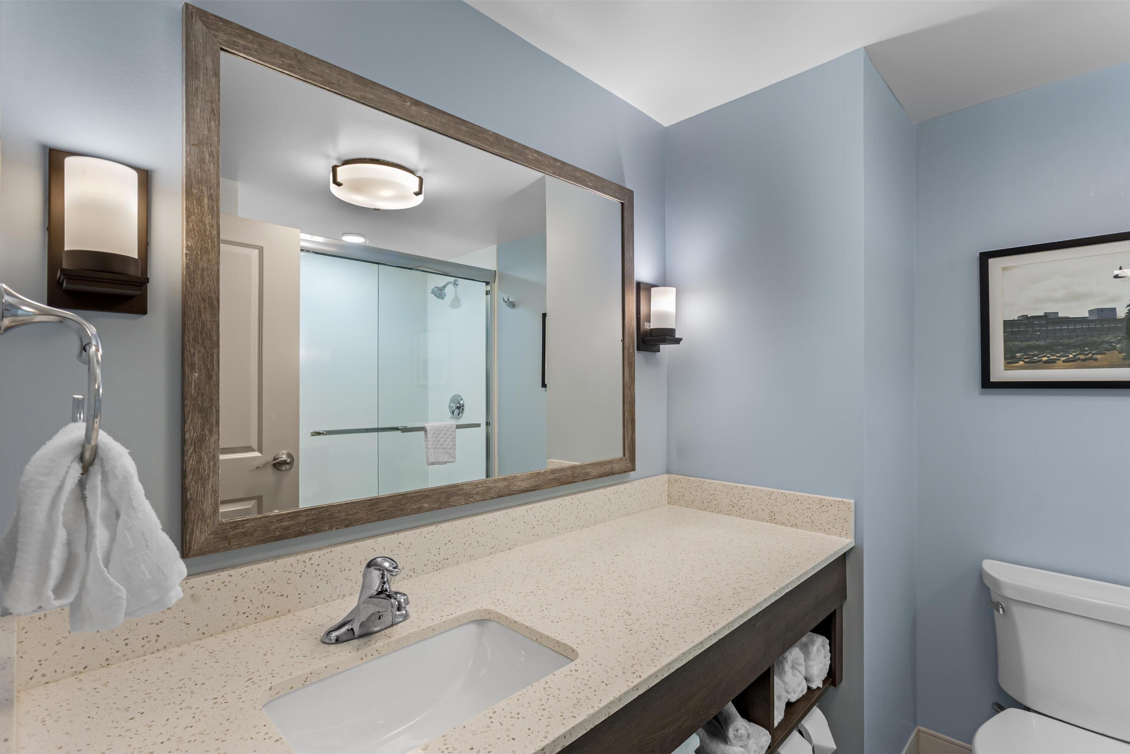 designer toiletries, hair dryer, towels, soap