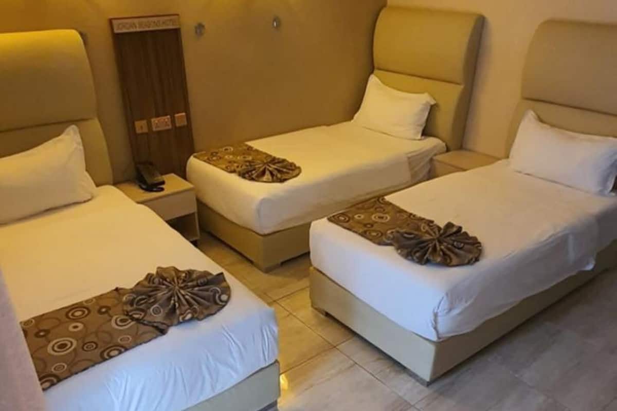 deluxe triple room, mountain view | minibar, in-room safe, desk, laptop workspace