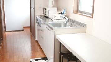 Fridge, microwave, cookware/dishes/utensils