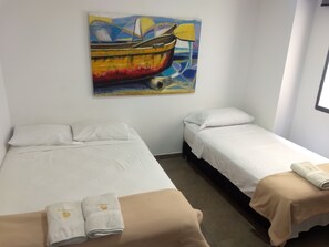 Superior Triple Room | Minibar, in-room safe, iron/ironing board, free WiFi - Hotel Tayromar (Santa Marta)