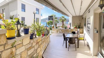 Enjoy breathtaking views of the water and mountains from this serene outdoor space.