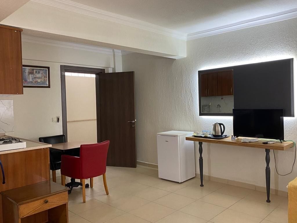 family room, kitchenette | private kitchen | fridge