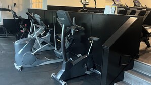 A gym with multiple exercise machines, including treadmills and elliptical trainers, arranged in rows. - Attitash Mountain Resort Condo- 3 Floors, Sleeps 12- Story Land, Ski, Shop, Golf (Bartlett)