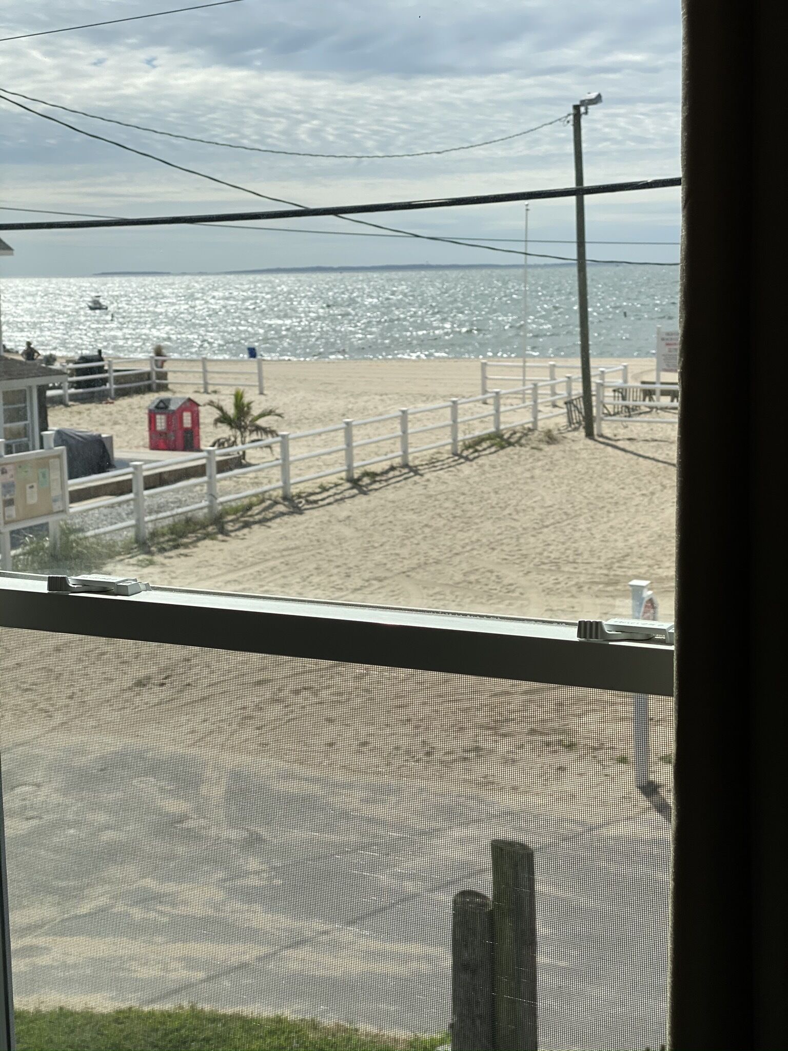 Comforts of home steps from a sandy private beach!!