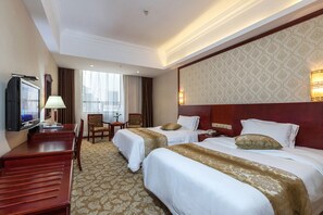 Habitación Deluxe con 2 camas individuales | Escritorio, cortinas blackout, wifi gratis y ropa de cama 